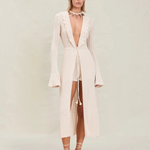 Model wearing KABE SHOP INC Christine Short in cream knit with matching long-sleeved open robe and lace-up sandals.