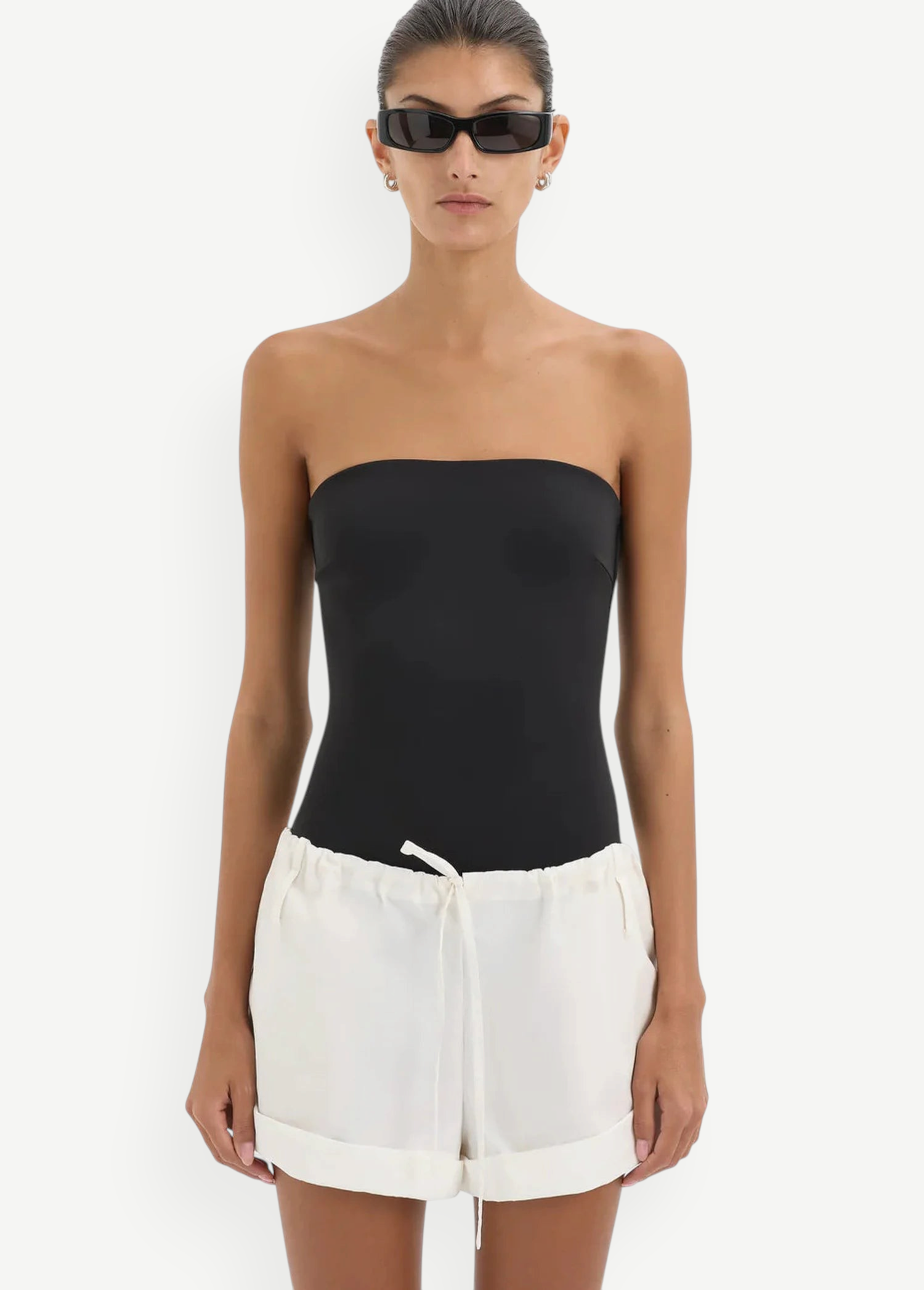KABE SHOP INC Charlie Rolled Short in white cotton with a drawstring waistband worn by a model in a black bodysuit.