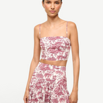 Model wearing KABE SHOP INC Federico cropped tank top in pink and white tropical toile de jouy print