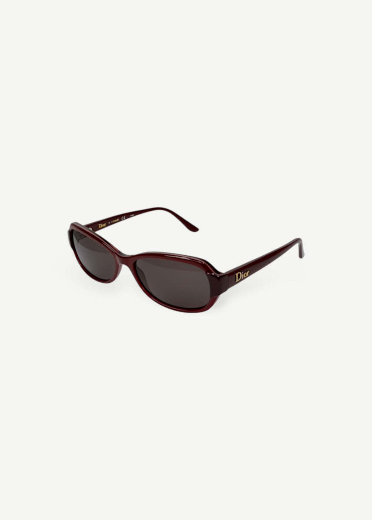 KABE SHOP INC Christian Dior sunglasses featuring a dark burgundy oval frame with gold logo detailing on the temples.