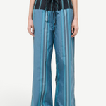 Mateo Pant wide-leg trousers featuring a blue and dark green vertical stripe pattern with a black drawstring waistband.