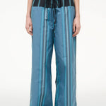 Mateo Pant wide-leg trousers featuring a blue and dark green vertical stripe pattern with a black drawstring waistband.