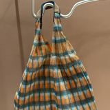 KABE SHOP INC Udaipur bag by ÉPICE featuring a vibrant orange, blue, and white plaid woven mesh fabric