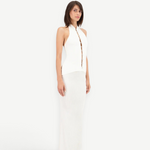 Model wearing KABE SHOP INC Classic Malageta white maxi skirt and matching sleeveless button-down halter top