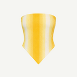 The Triangle Top is a strapless, yellow and white striped bandana-style top with a pointed hem, inspired by traditional Moroccan weaving techniques, shown against a plain white background.