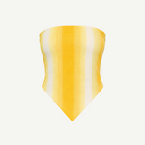 The Triangle Top is a strapless, yellow and white striped bandana-style top with a pointed hem, inspired by traditional Moroccan weaving techniques, shown against a plain white background.