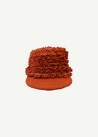 KABE SHOP INC handcrafted burnt orange crochet sun hat with textured fringe detailing and a solid brim