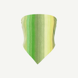 The Triangle Top, a triangular bandana featuring vertical green and yellow stripes, is crafted using traditional Moroccan weaving techniques by skilled Marrakech artisans and shown on a plain white background.