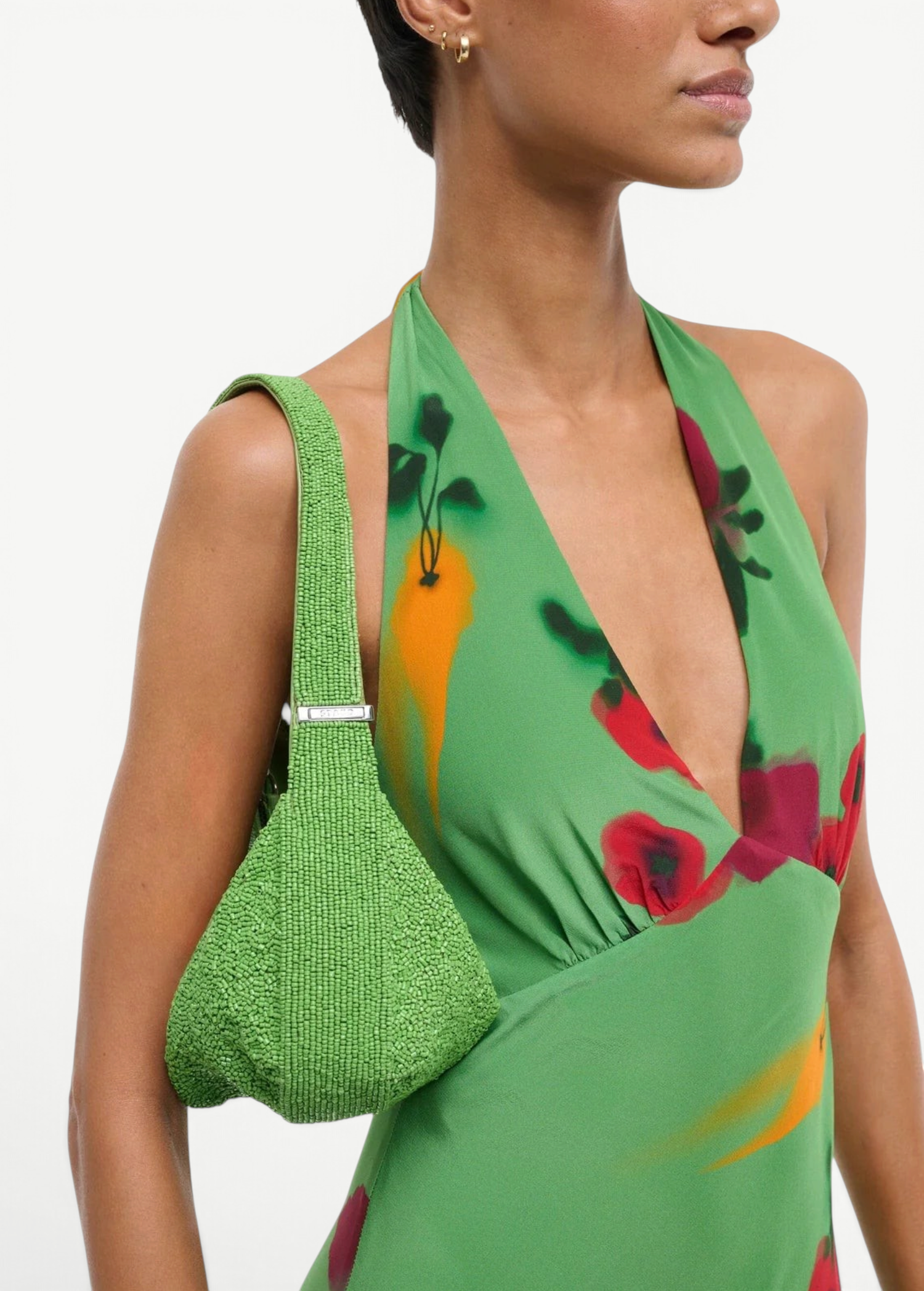 KABE SHOP INC Demy shoulder bag in bright green beaded texture worn over the shoulder with a matching floral dress