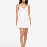 KABE SHOP INC Dena mini dress in white cotton poplin with a fitted bodice and drop waist on a model