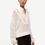 Cream-colored Cropped Hampton Sweater in a versatile knit, featuring an open-stitch texture and a quarter-zip mock neck.