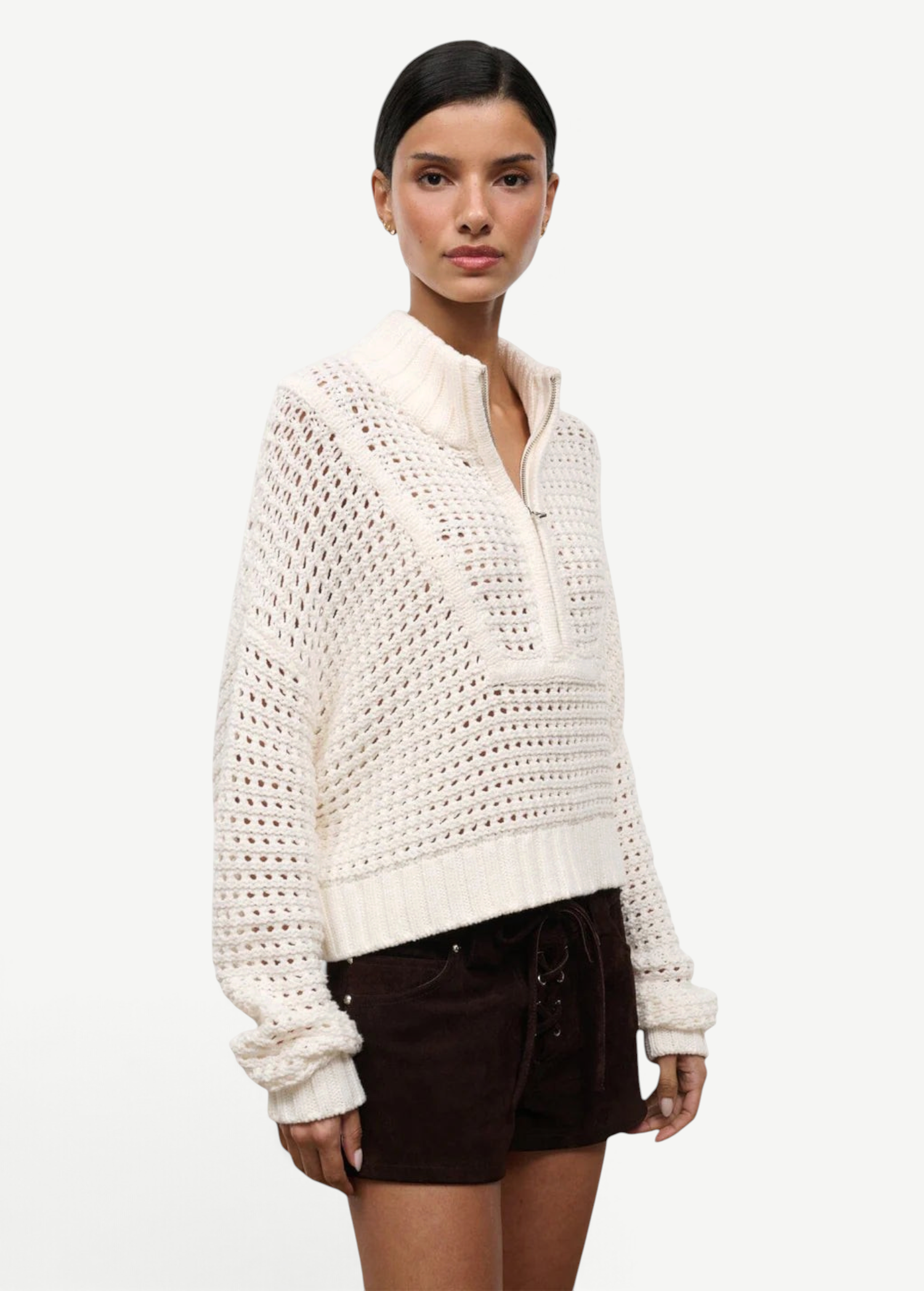 Cream-colored Cropped Hampton Sweater in a versatile knit, featuring an open-stitch texture and a quarter-zip mock neck.