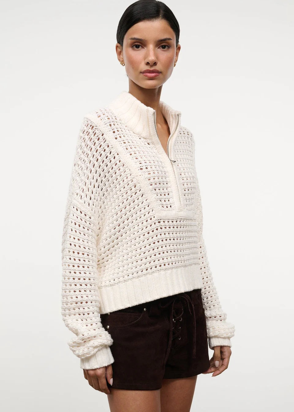 Cream-colored Cropped Hampton Sweater in a versatile knit, featuring an open-stitch texture and a quarter-zip mock neck.