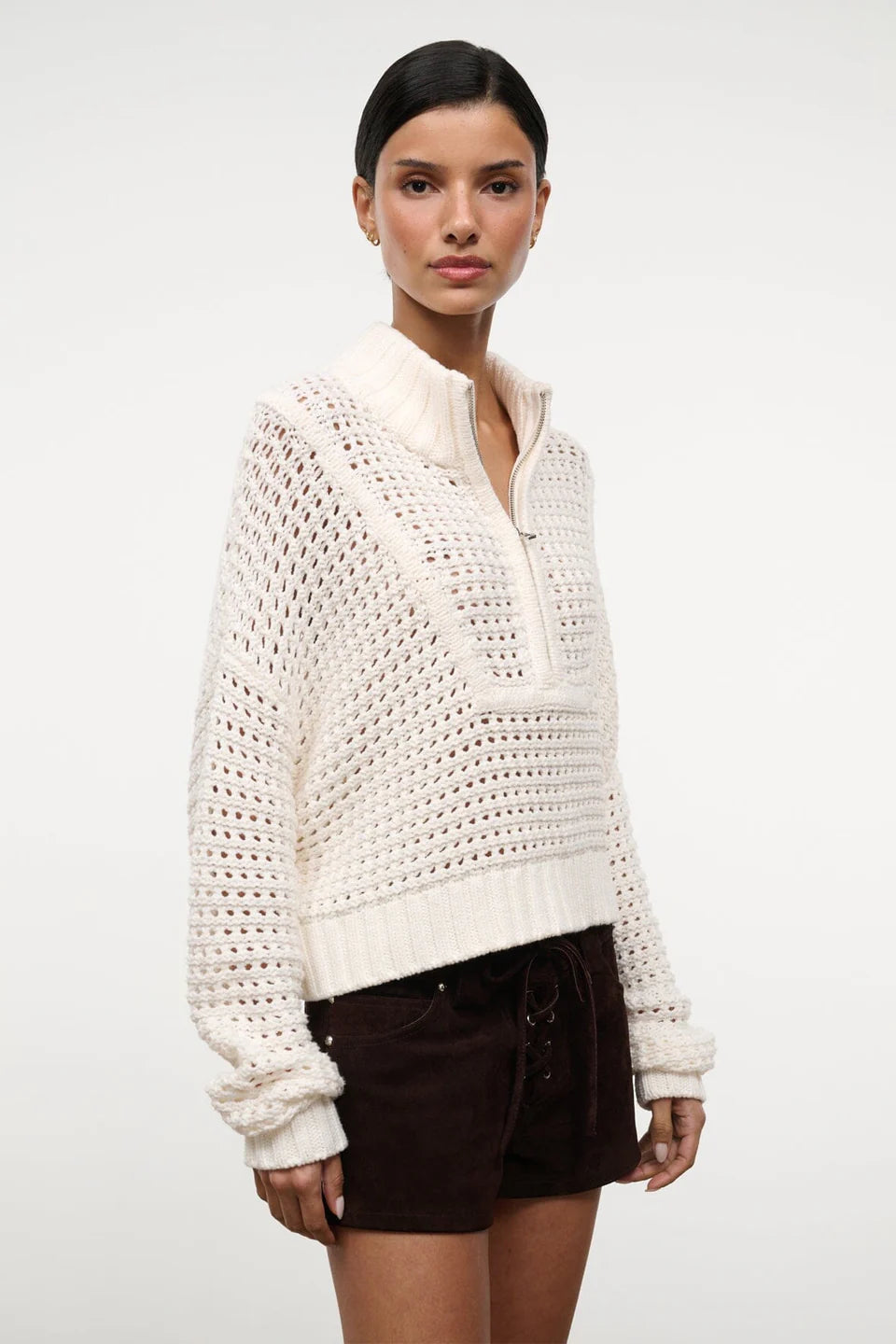 Cream-colored Cropped Hampton Sweater in a versatile knit, featuring an open-stitch texture and a quarter-zip mock neck.