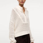 Cream-colored Cropped Hampton Sweater in a versatile knit, featuring an open-stitch texture and a quarter-zip mock neck.