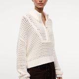 Cream-colored Cropped Hampton Sweater in a versatile knit, featuring an open-stitch texture and a quarter-zip mock neck.