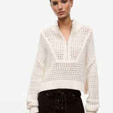 Off-white Cropped Hampton Sweater with a quarter-zip neckline and an open-knit texture, serving as a versatile knit for everyday dressing.
