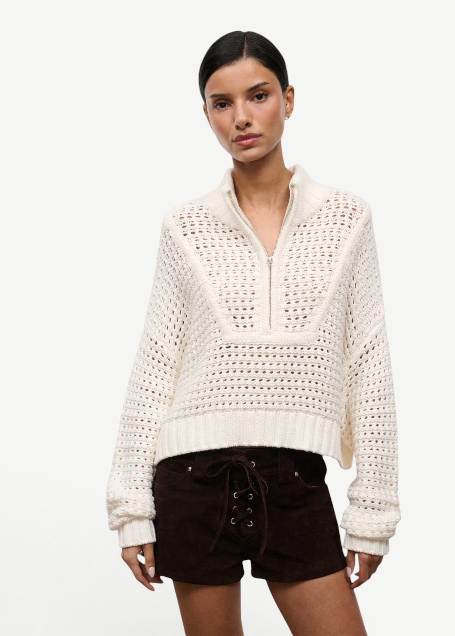 Off-white Cropped Hampton Sweater with a quarter-zip neckline and an open-knit texture, serving as a versatile knit for everyday dressing.