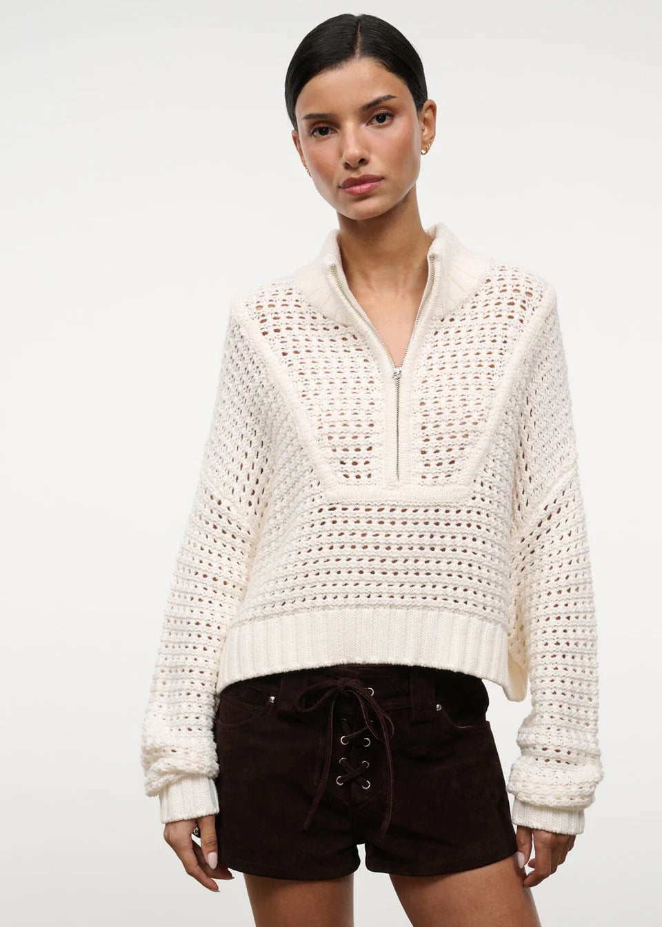 Off-white Cropped Hampton Sweater with a quarter-zip neckline and an open-knit texture, serving as a versatile knit for everyday dressing.