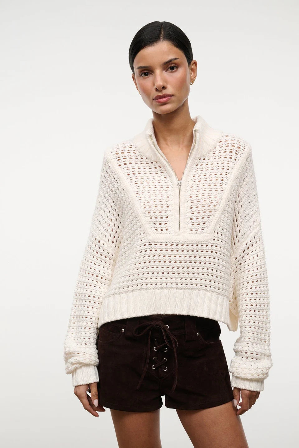 Off-white Cropped Hampton Sweater with a quarter-zip neckline and an open-knit texture, serving as a versatile knit for everyday dressing.
