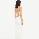 Model wearing a white KABE SHOP INC Classic Malageta maxi skirt with a matching backless tie-up top