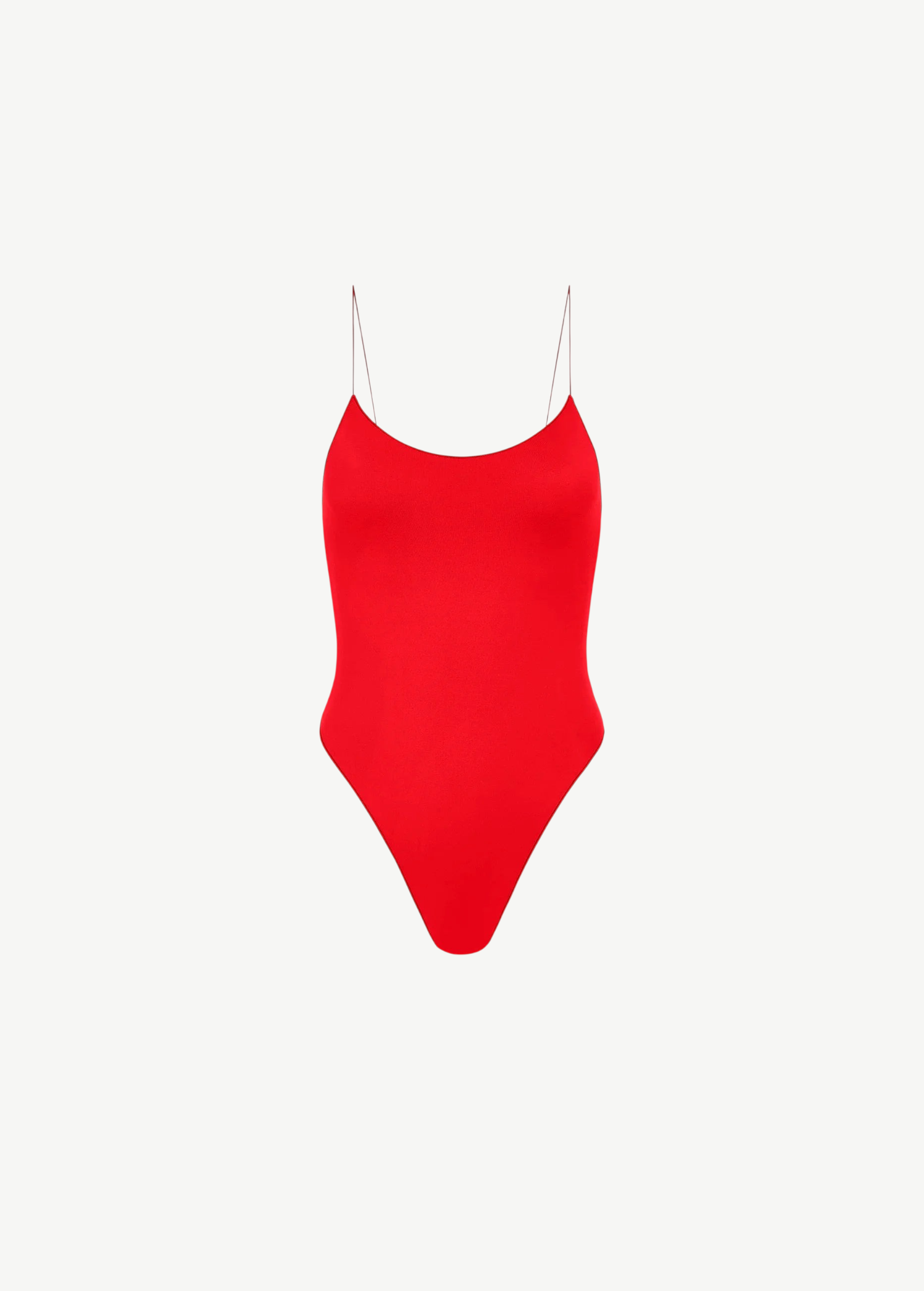 The C One Piece is a vibrant red one-piece swimsuit made from recycled nylon, featuring thin spaghetti straps and a high-cut leg, shown against a plain white background.