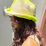 KABE SHOP INC Pora crochet bucket hat in lime green and cream tie-dye worn by a woman outdoors