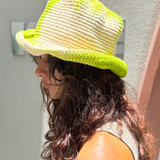 KABE SHOP INC Pora crochet bucket hat in lime green and cream tie-dye worn by a woman outdoors