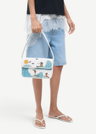 KABE SHOP INC Tommy beaded shoulder bag featuring a white background with a colorful surfing scene and sun motif.