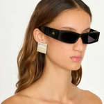 Model wearing KABE SHOP INC Colbi Earrings, featuring a bold silver-plated geometric square design