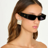 Model wearing KABE SHOP INC Colbi Earrings, featuring a bold silver-plated geometric square design