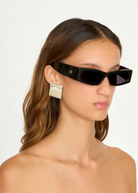 Model wearing KABE SHOP INC Colbi Earrings, featuring a bold silver-plated geometric square design