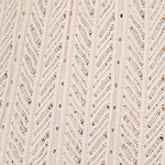 Close-up of the beige knit fabric of the KABE SHOP INC Christine Short featuring a detailed chevron texture.