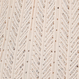 Close-up of the beige knit fabric of the KABE SHOP INC Christine Short featuring a detailed chevron texture.