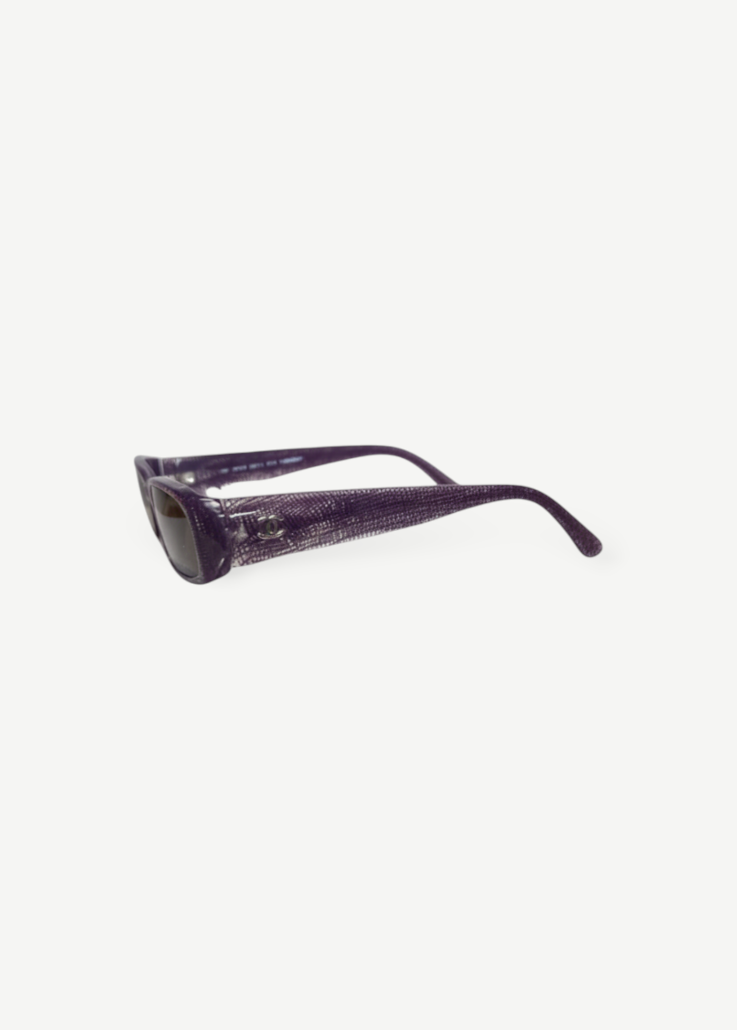 KABE SHOP INC pre-owned Chanel sunglasses in a deep purple textured finish with iconic logo detail on the temples.