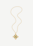 KABE SHOP INC Croix Baroque gold necklace featuring an ornate cross pendant with turquoise stone accents