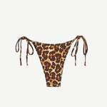 Praia Bottom in a leopard print, featuring a minimal coverage triangle bikini design with adjustable side ties, displayed on a white background.