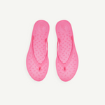 KABE SHOP INC bright pink jelly flip flops with a textured teardrop pattern on the footbed for summer wear.