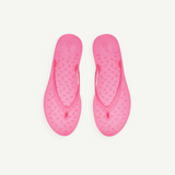 KABE SHOP INC bright pink jelly flip flops with a textured teardrop pattern on the footbed for summer wear.