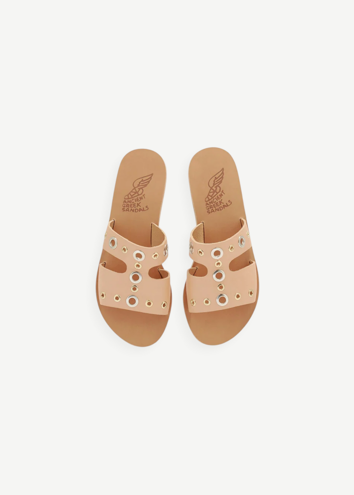 KABE SHOP INC Apteros slide sandals in tan leather with silver and gold metallic eyelet hardware details.