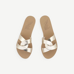 KABE SHOP INC Desmos sandals in metallic gold leather with elegant interlocking straps and a flat tan sole.