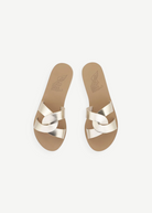 KABE SHOP INC Desmos sandals in metallic gold leather with elegant interlocking straps and a flat tan sole.
