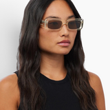 Model wearing KABE SHOP INC Verve rectangular sunglasses with translucent frames and dark lenses