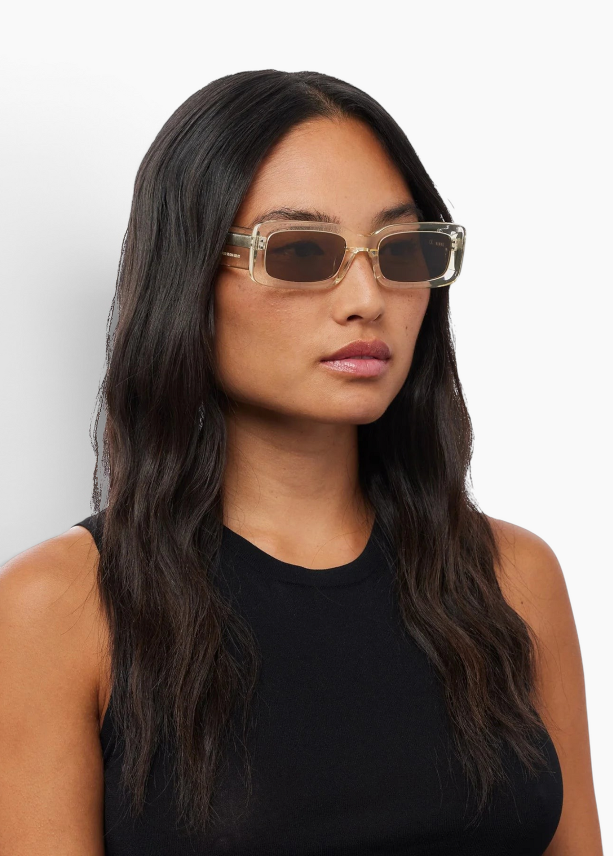 Model wearing KABE SHOP INC Verve rectangular sunglasses with translucent frames and dark lenses
