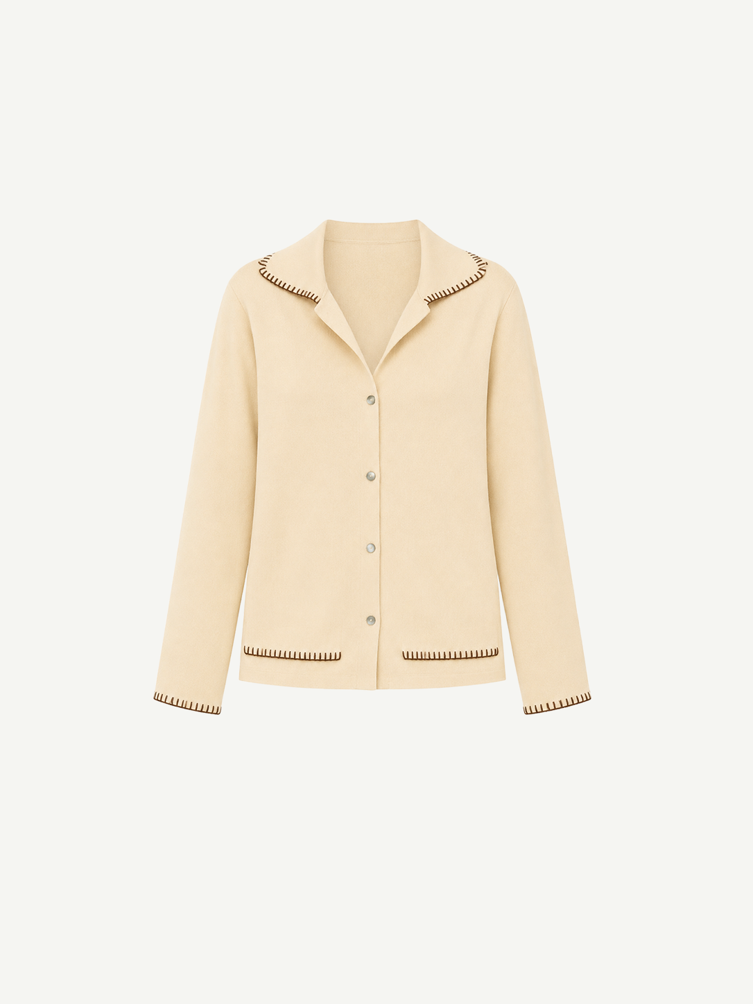 Cream-colored Iris Top cardigan with a relaxed silhouette, featuring a notched collar and dark brown blanket stitching on the collar, cuffs, and hem pockets.