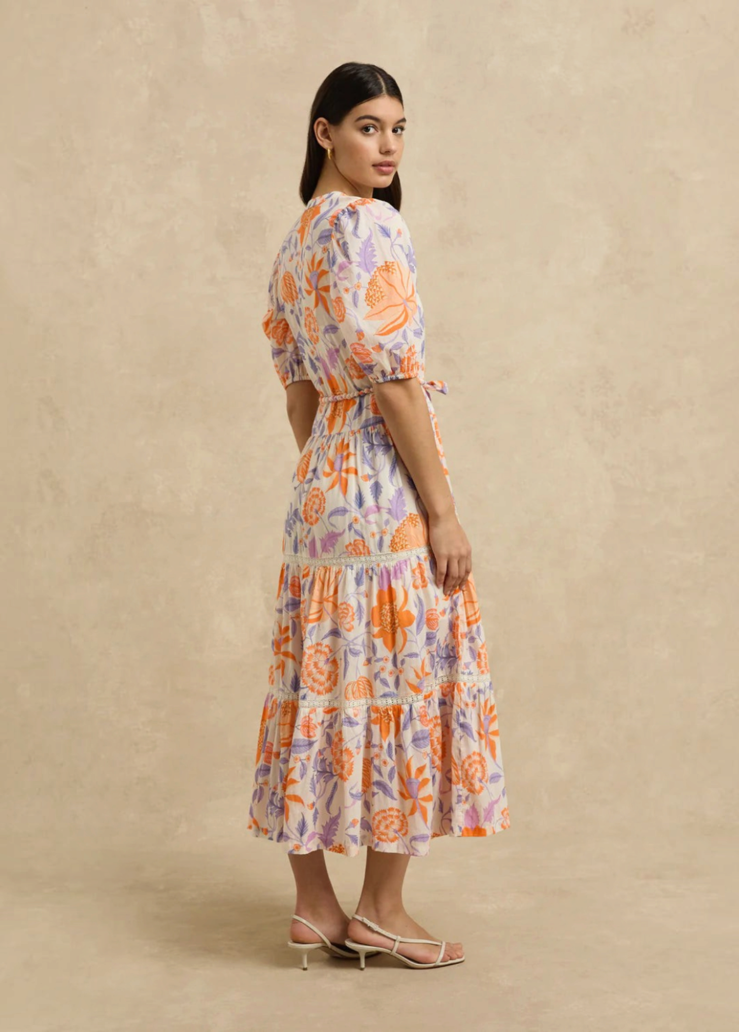 KABE SHOP INC Anyeta dress featuring a feminine floral print in orange and purple with a defined waist and midi hem