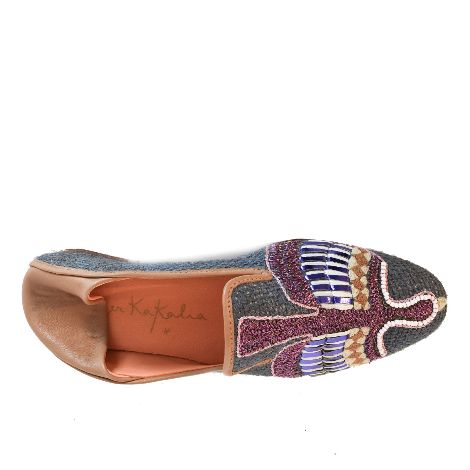 Top view of the Anzu Moccasin, a sustainable slip-on shoe featuring a textured, woven gray upper and a tan insole. The toe is adorned with a beaded, embroidered bird design in purple, blue, and gold tones.