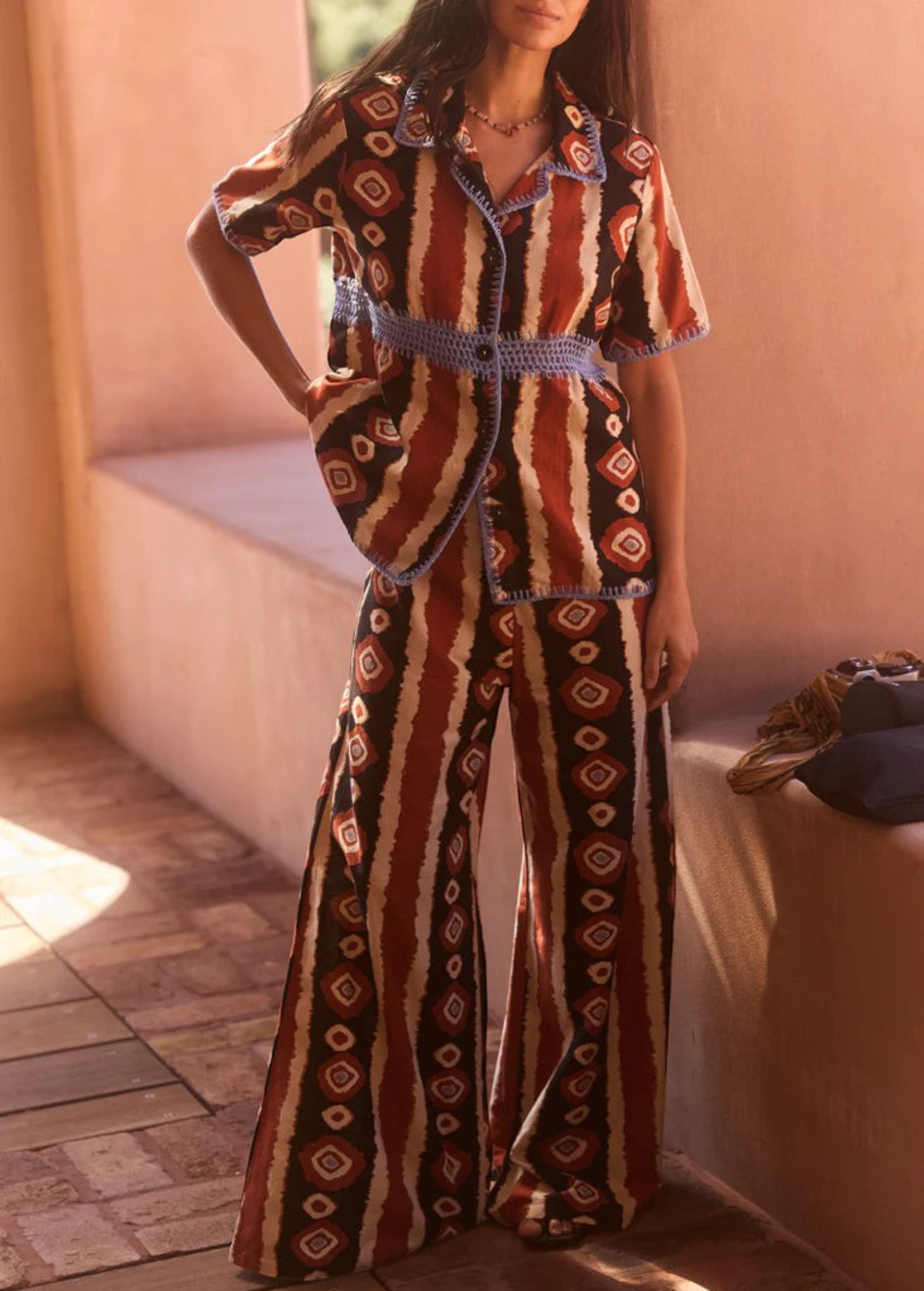 KABE SHOP INC Nera shirt featuring a tribal ikat print with blue crochet trim and a relaxed oversized fit.