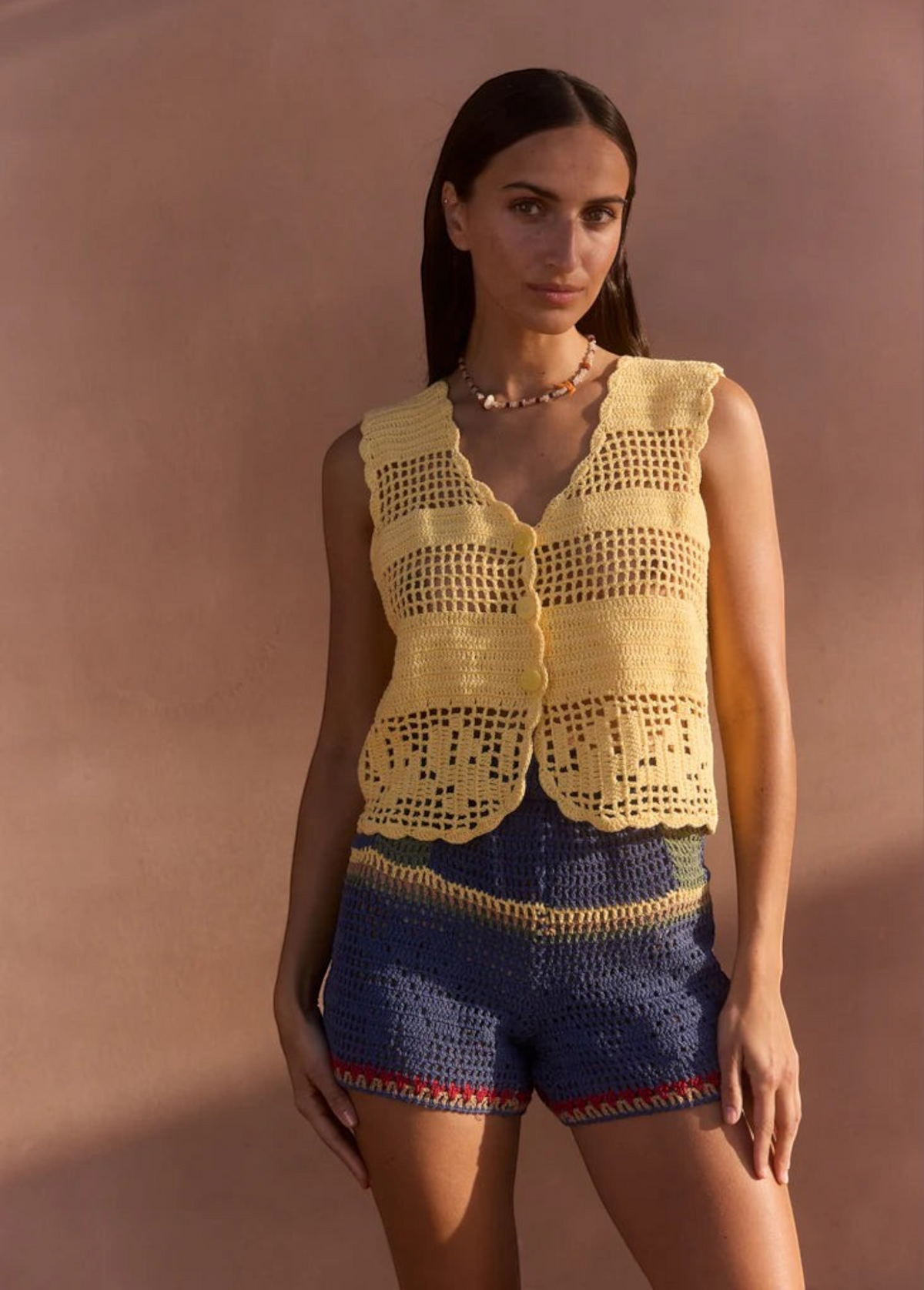 KABE SHOP INC Nova Shorts in multicolored floral crochet paired with a yellow crochet vest on a model