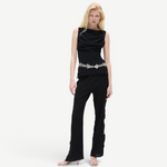 KABE SHOP INC Malaika pants in black with a straight-leg silhouette, worn by a blonde model with a silver belt.